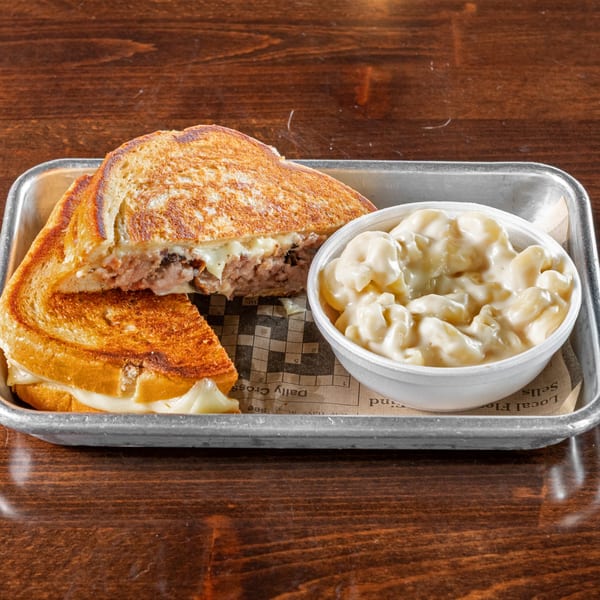 A Gaskins Barbecue and Lobster grilled cheese sandwich with brisket and a side of mac and cheese.