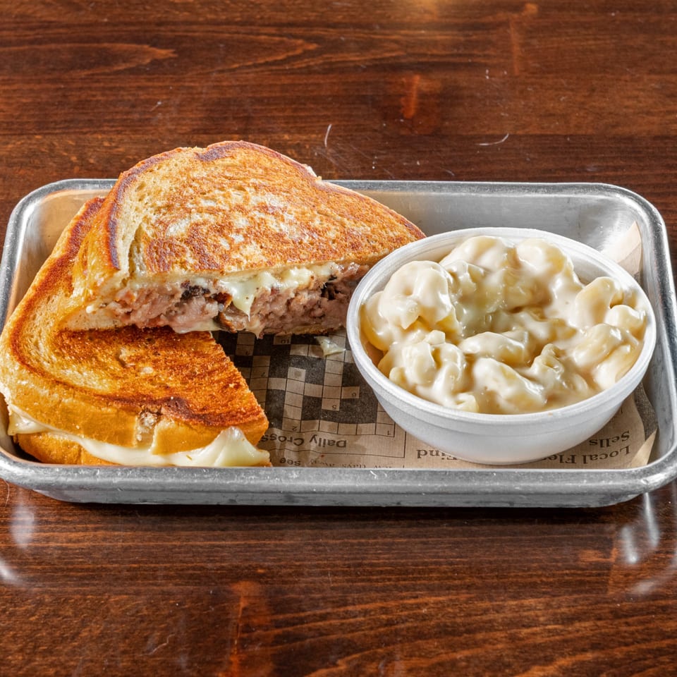 A Gaskins Barbecue and Lobster grilled cheese sandwich with brisket and a side of mac and cheese.